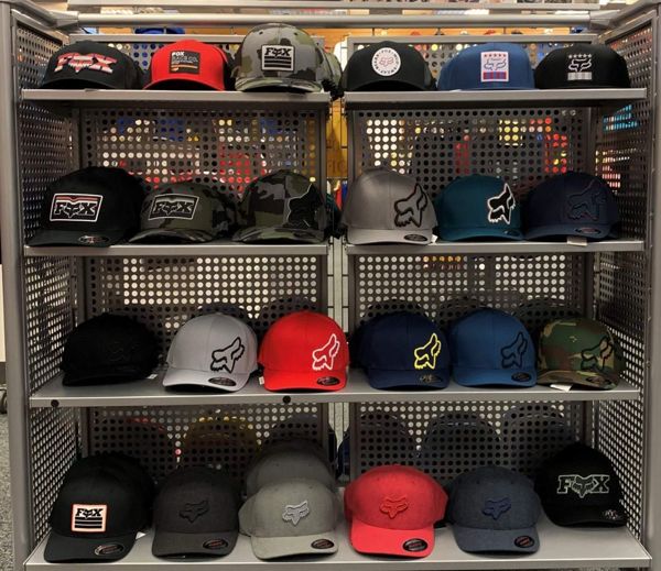 Wire retail display rack for Fox brand hats. 24 different hats are shown in all different styles and colors.